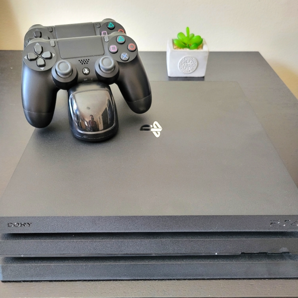 PS4 PRO package with 2 controllers and charging system great condition